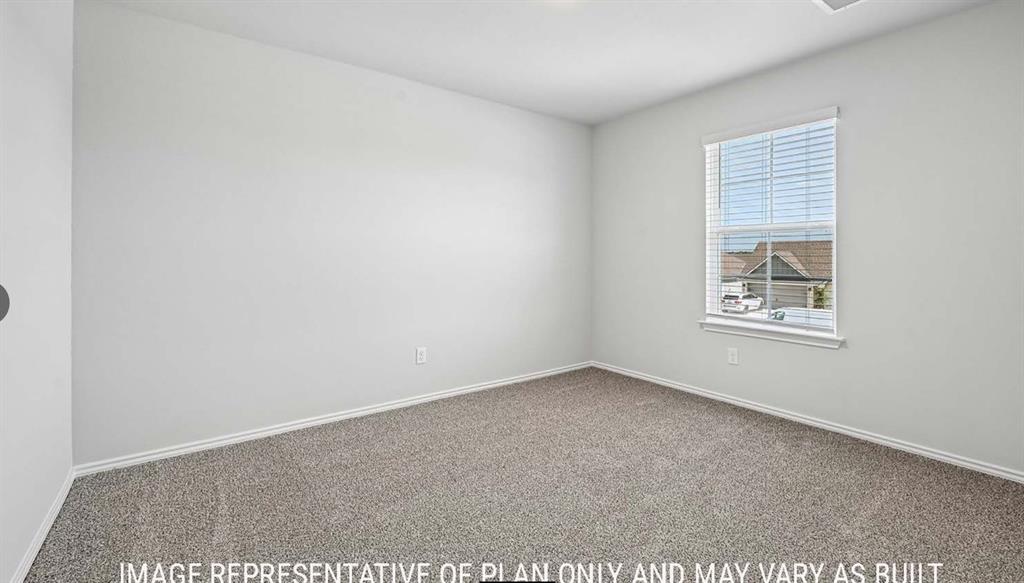 Neutral-toned interior space featuring plush carpeting, a single-hung window with horizontal blinds, and a smooth-finish ceiling