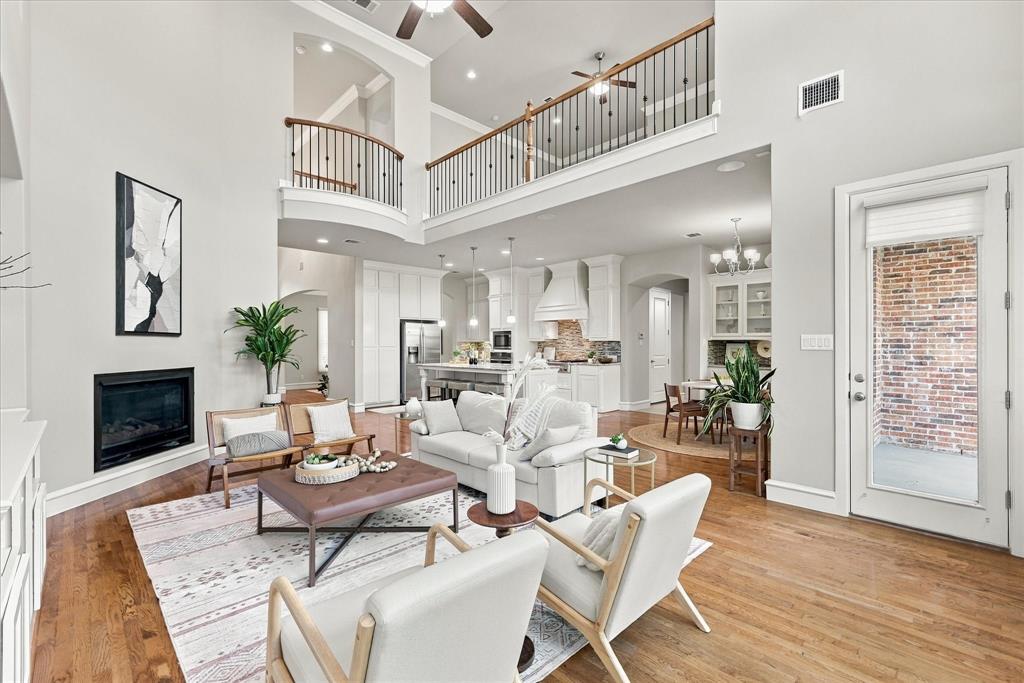 Living Room has a fireplace focal point and opens to the kitchen areas