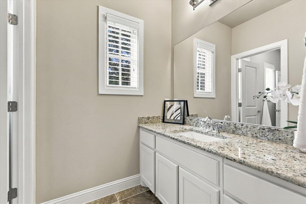 Jack and Jill bathroom with granite counters