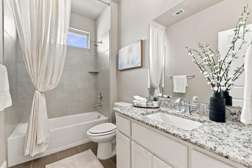 Adjacent hall guest bathroom with granite counters