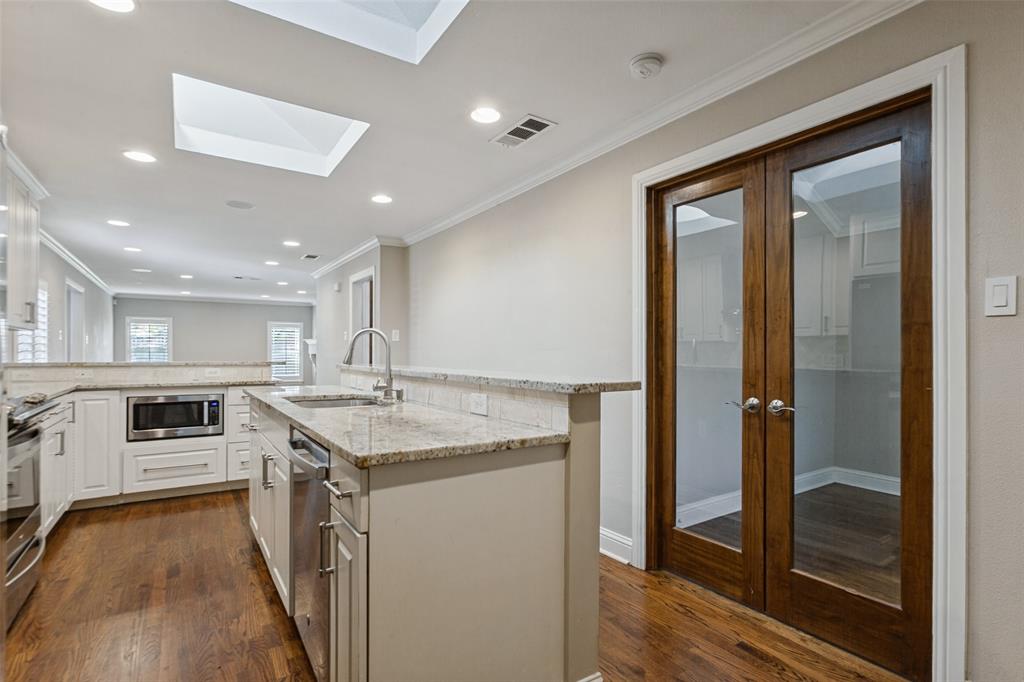 Kitchen showing access to 3rd bedroom or office