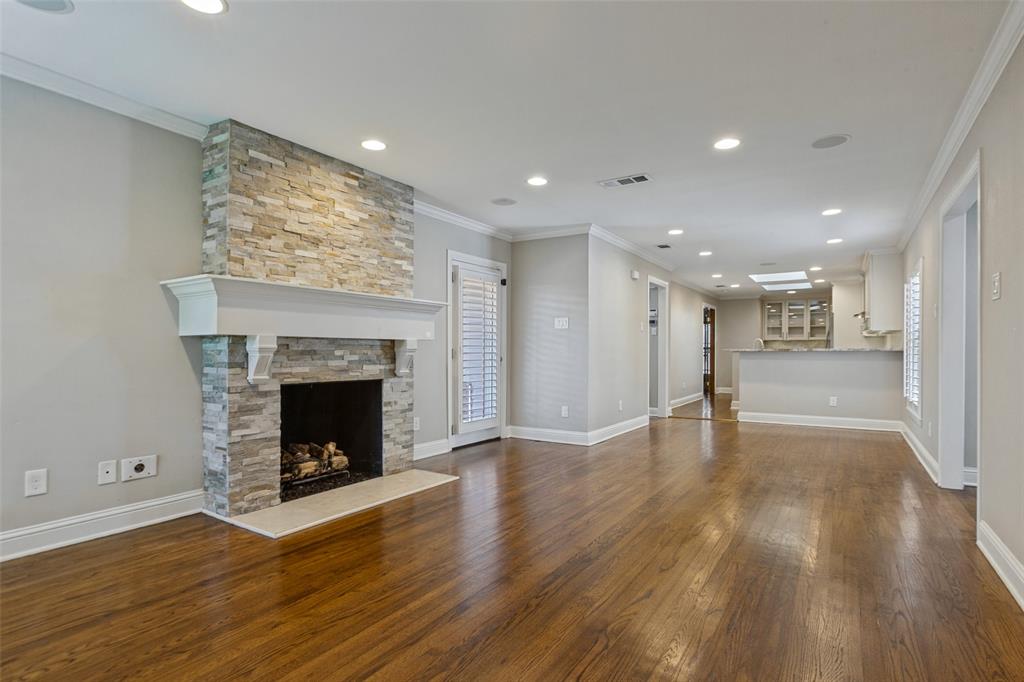 Living area w gas-log fireplace and backyard access
