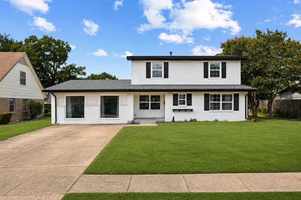 Two-story exterior featuring painted brick and siding, a concrete driveway, a gabled roof, and dark decorative shutters Two-story exterior featuring painted brick and siding, a concrete driveway, a gabled roof, and dark decorative shutters