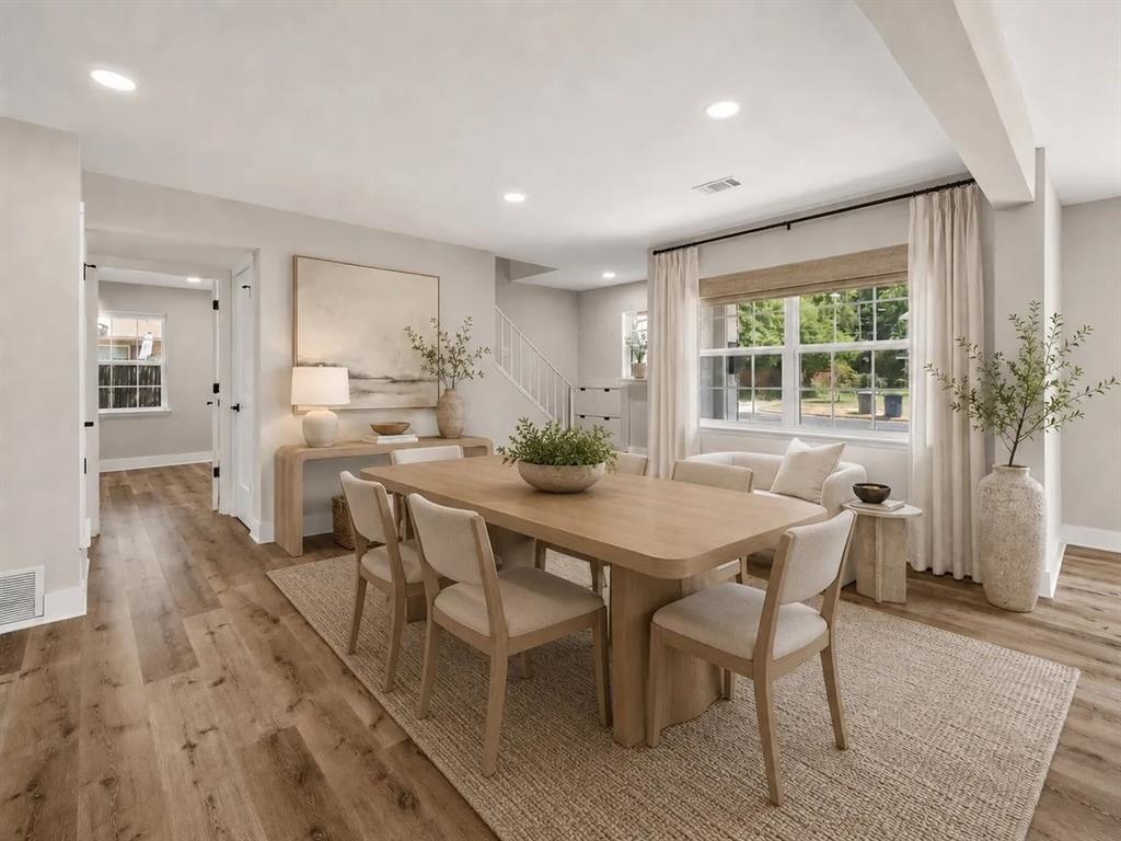 Dining area featuring wood-finish flooring, recessed lighting, and a multi-pane window with natural light Dining area featuring wood-finish flooring, recessed lighting, and a multi-pane window with natural light