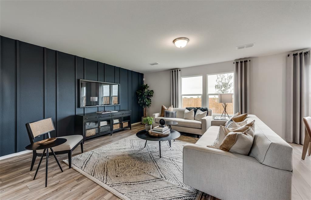 *Model Representation - Spacious gathering room with large windows