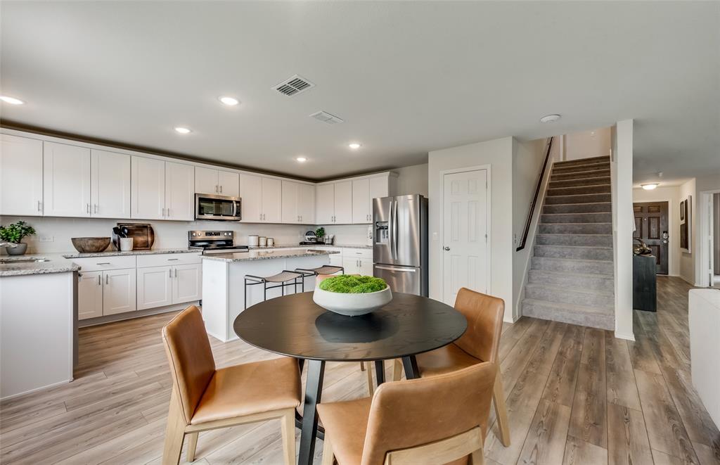 *Model Representation - Dining area off kitchen with large windows