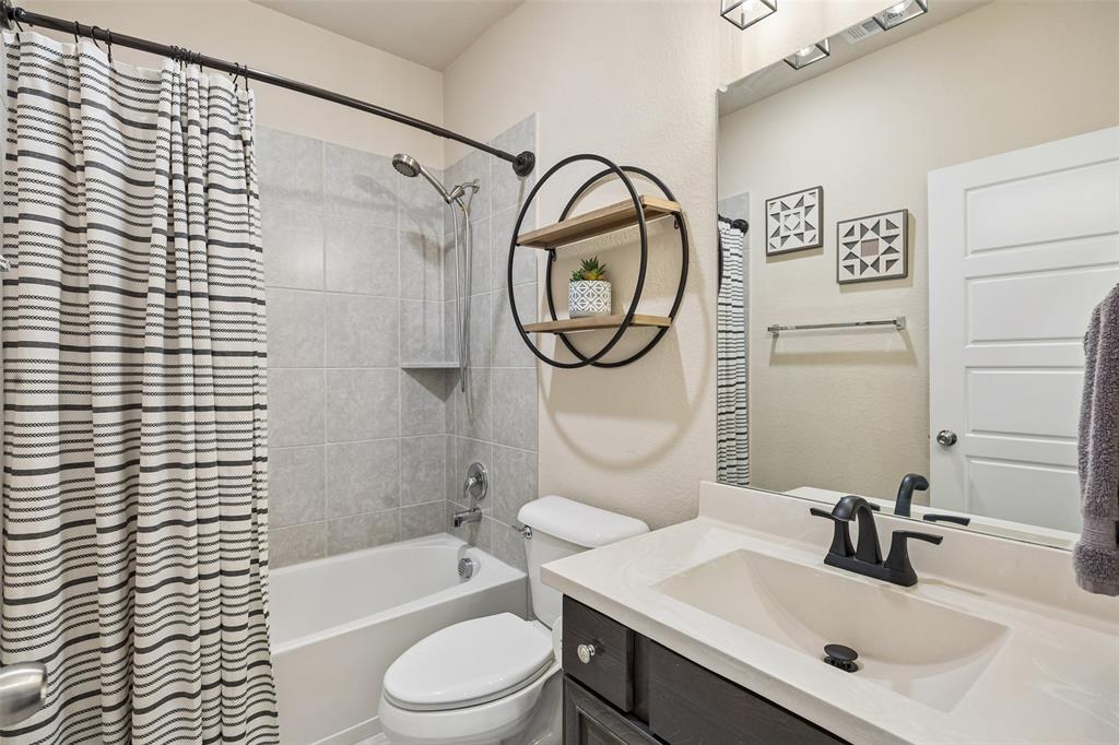 Full bathroom featuring a shower-tub combination Full bathroom featuring a shower-tub combination