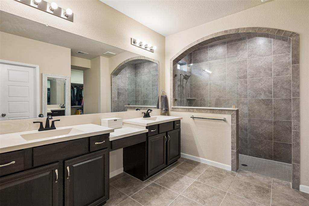 The ensuite praimary bathroom features an oversized walk in shower.