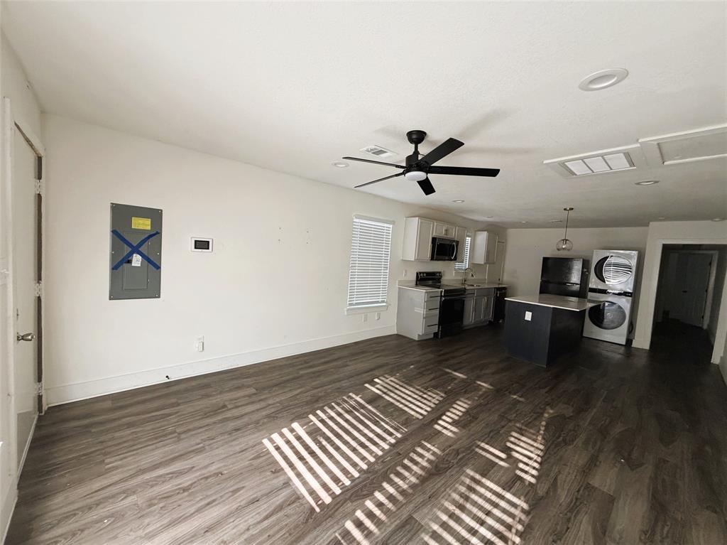 Reverse of living with kitchen and dining.