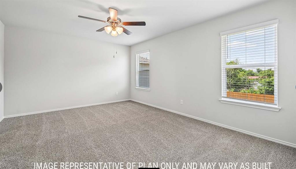 Neutral-toned carpeting, multi-pane windows with horizontal blinds, and a ceiling-mounted light fixture with a fan