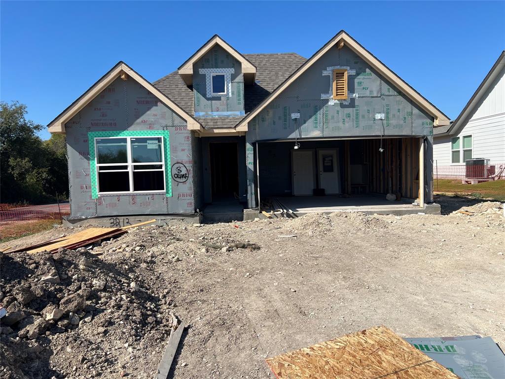 Single-story architectural design featuring a multi-gabled roofline, a front-facing attached two-car garage, and a central covered entryway Single-story architectural design featuring a multi-gabled roofline, a front-facing attached two-car garage, and a central covered entryway