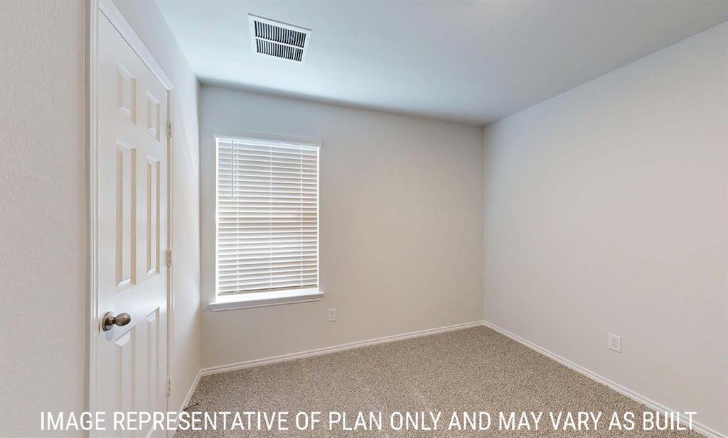 Neutral-toned carpeted flooring, white six-panel interior door with a round satin-finish knob, and window with white horizontal blinds