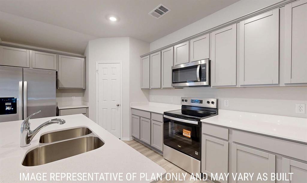 Kitchen featuring light grey shaker-style cabinetry, white quartz countertops, stainless steel appliances, and a dual-basin undermount sink with a gooseneck faucet Kitchen featuring light grey shaker-style cabinetry, white quartz countertops, stainless steel appliances, and a dual-basin undermount sink with a gooseneck faucet
