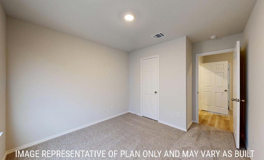 Neutral-toned interior featuring wall-to-wall carpeting, six-panel interior doors, and recessed lighting