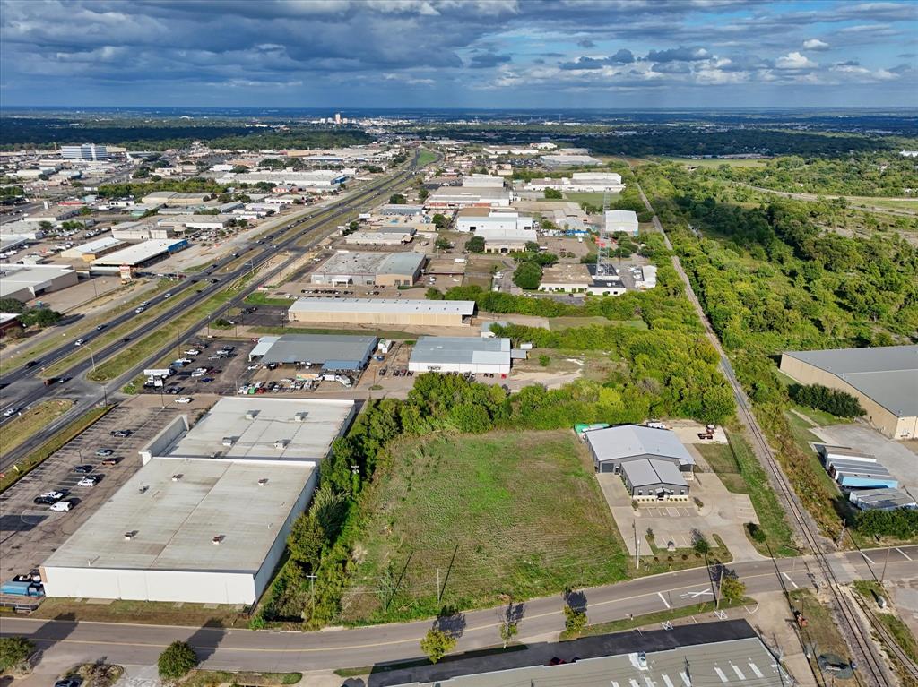Aerial view of the industrial parcel featuring direct road frontage, proximity to major highway corridors, and railroad access