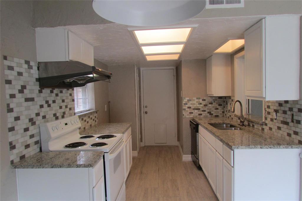 Kitchen featuring white cabinetry, stone-finish countertops, mosaic tile backsplash, wood-finish flooring, and recessed ceiling lighting