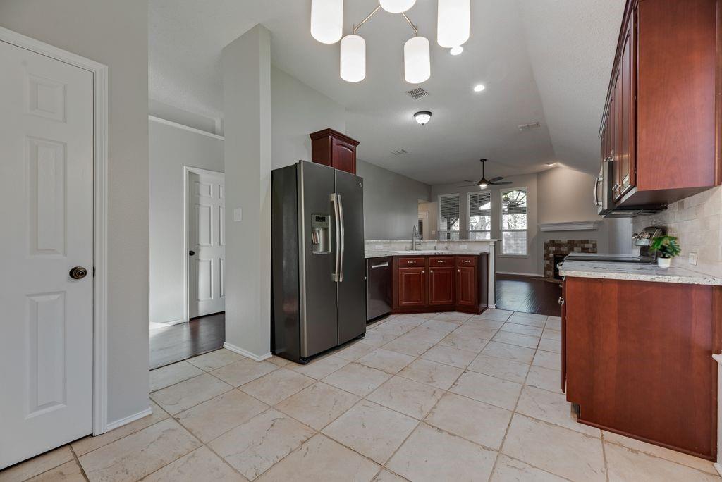 Chef's dream kitchen complete with new Bosch dishwasher, extended cabinets for extra storage space, granite counter tops, eat in kitchen with breakfast nook and bar, and sizeable pantry.