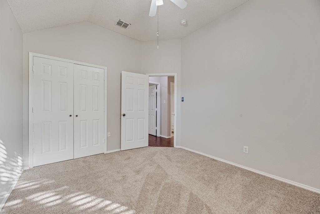 bedroom with ceiling fan and closet. Carpet installed October 2026