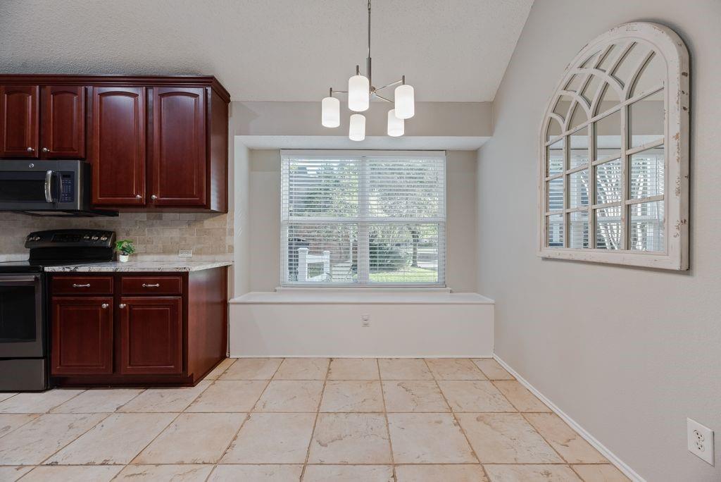 Dining area and large window to side yard.