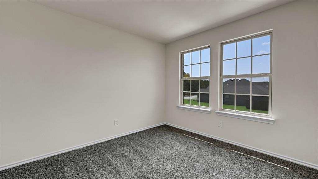 Dual pane windows with white trim, gray carpet flooring, and white painted walls