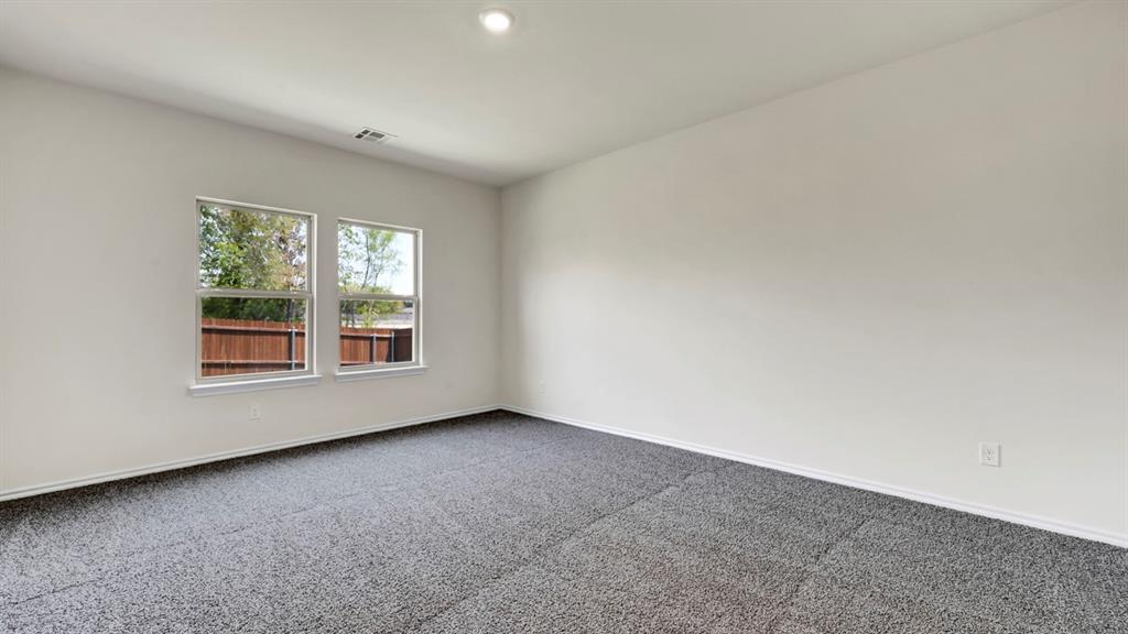 Recessed lighting, light gray carpeting, and dual windows Recessed lighting, light gray carpeting, and dual windows