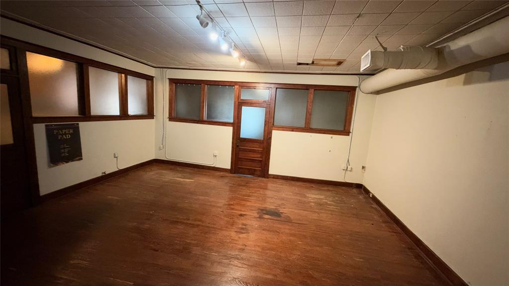 Private office with original hardwood floors and transom door Private office with original hardwood floors and transom door