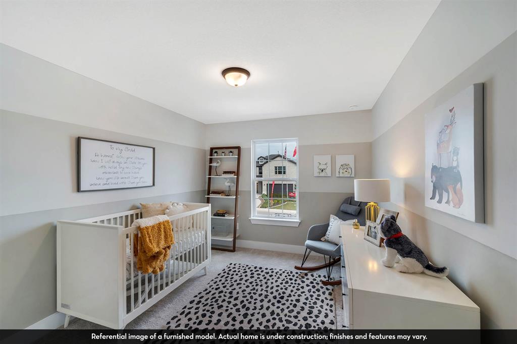 Room featuring two-toned wall paint, neutral carpeting, and a single-hung window with a sill