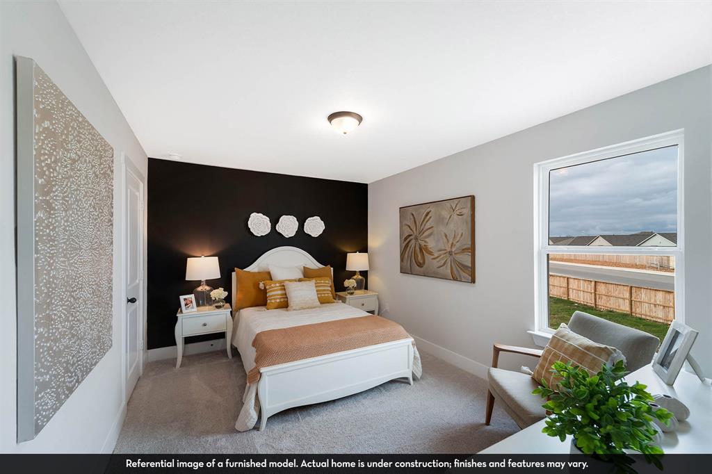 Neutral wall tones, accent wall, flush-mount ceiling light, and single-hung window with exterior view