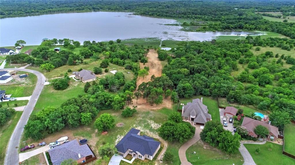 View of property location with a large body of water and nearby suburban area