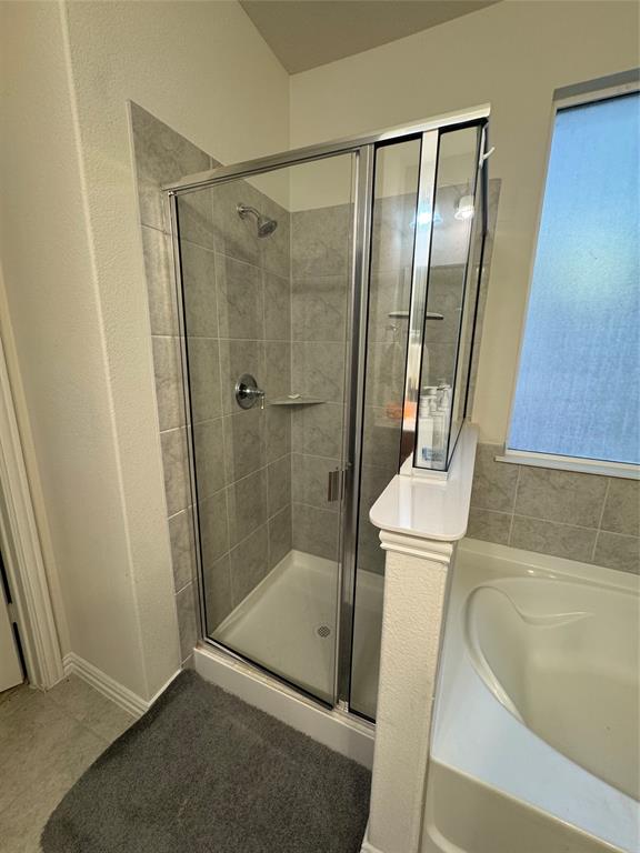 Separate shower and tub areas.