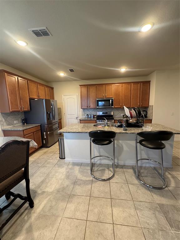 Island bar area. All appliances included.
