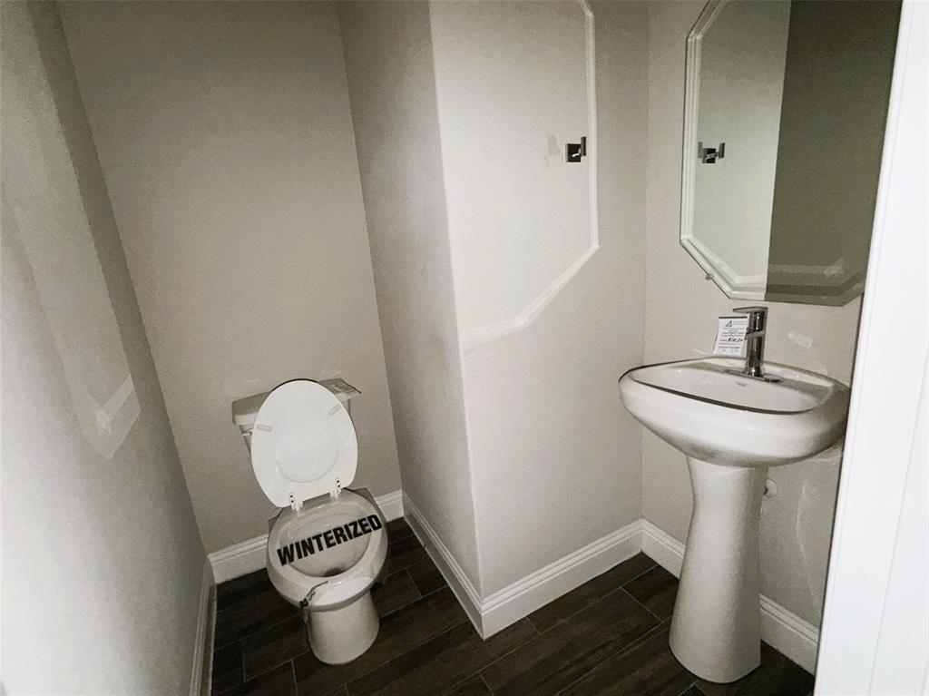 Guest powder room provides stylish convenience.