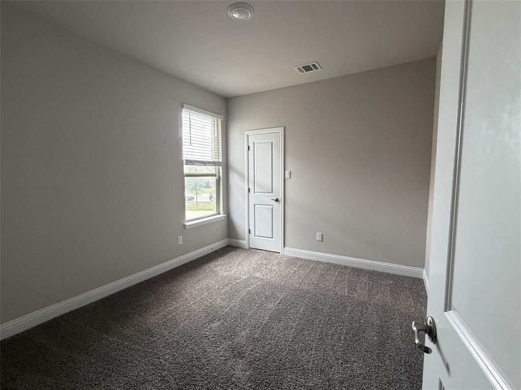 Reverse view reveals another walk-in closet.