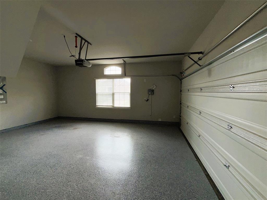 Easy-to-clean epoxy covers the floor of the 2-car garage.