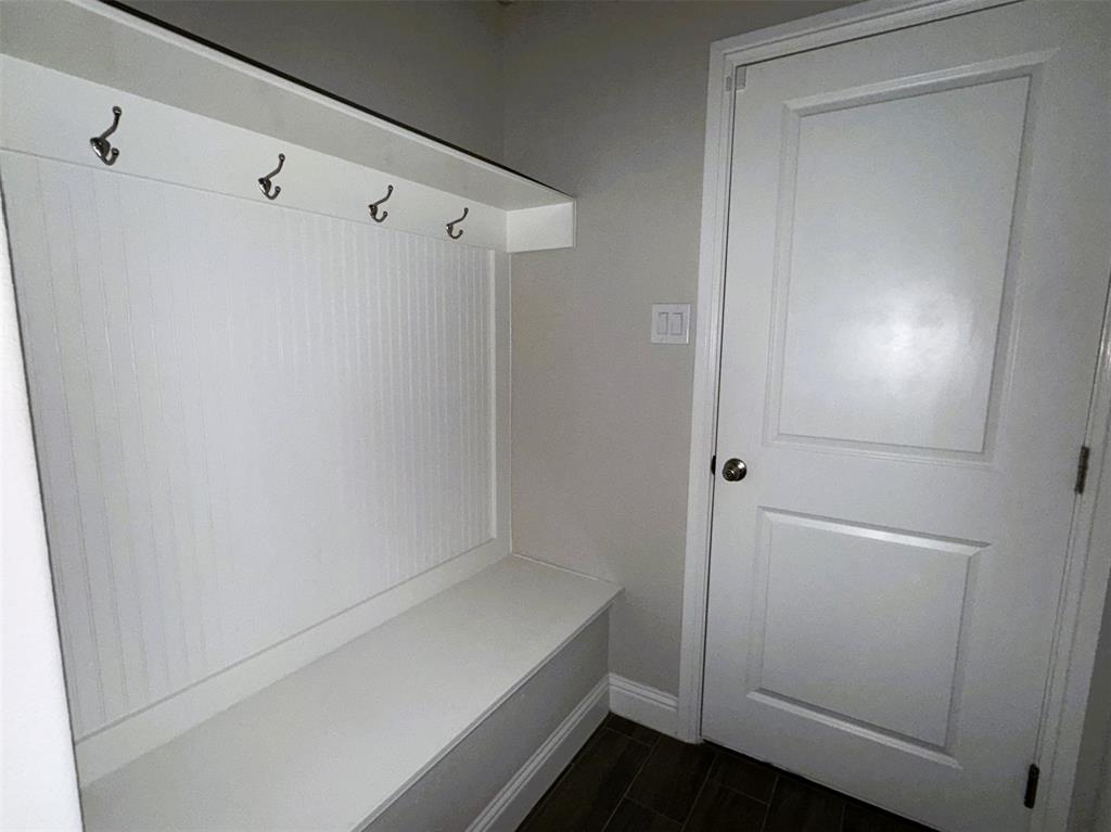 Just inside of the garage, the mud room is a perfect place for umbrellas, backpacks and winter clothing.