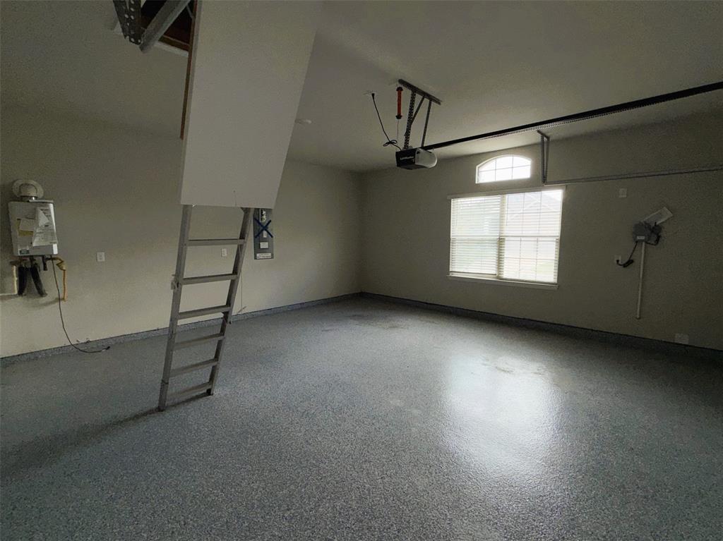 Pull-down stairs provide easy access to storage in the attic.