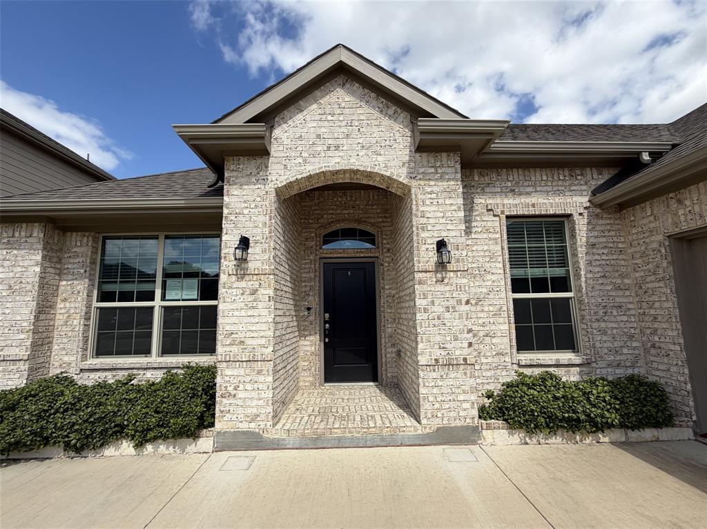 Regal and welcoming covered front porch greets family and friends.