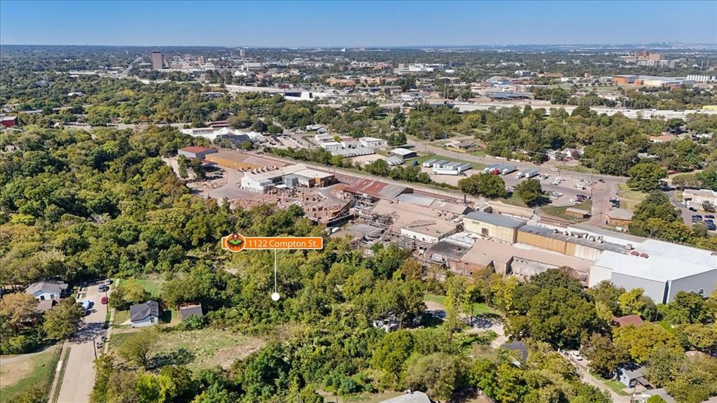 Aerial perspective of a parcel featuring extensive mature tree coverage and established ground-level vegetation