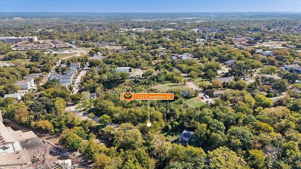 Aerial perspective of expansive treed lot featuring native vegetation and established canopy