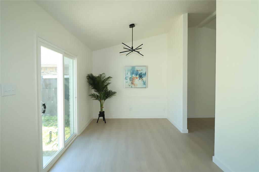 Brand new sliding glass door, and a modern multi-arm chandelier