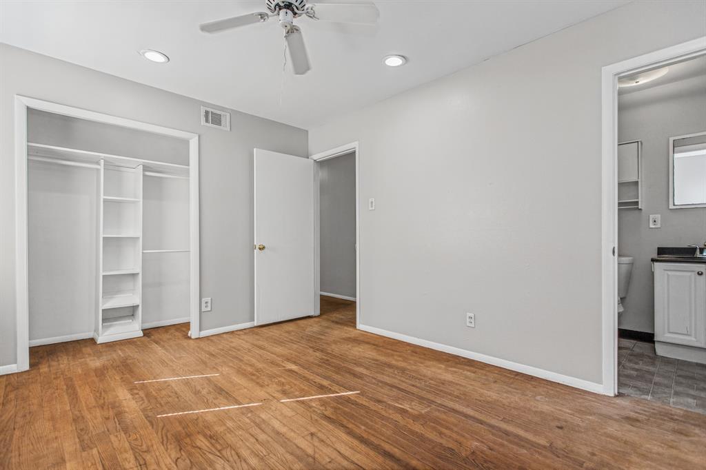 Wood-finish flooring, recessed lighting, ceiling fan, and built-in closet shelving