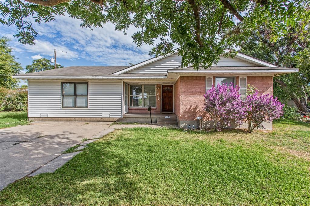 Single-story residence featuring a mixed brick and horizontal siding exterior, concrete driveway, and front porch Single-story residence featuring a mixed brick and horizontal siding exterior, concrete driveway, and front porch