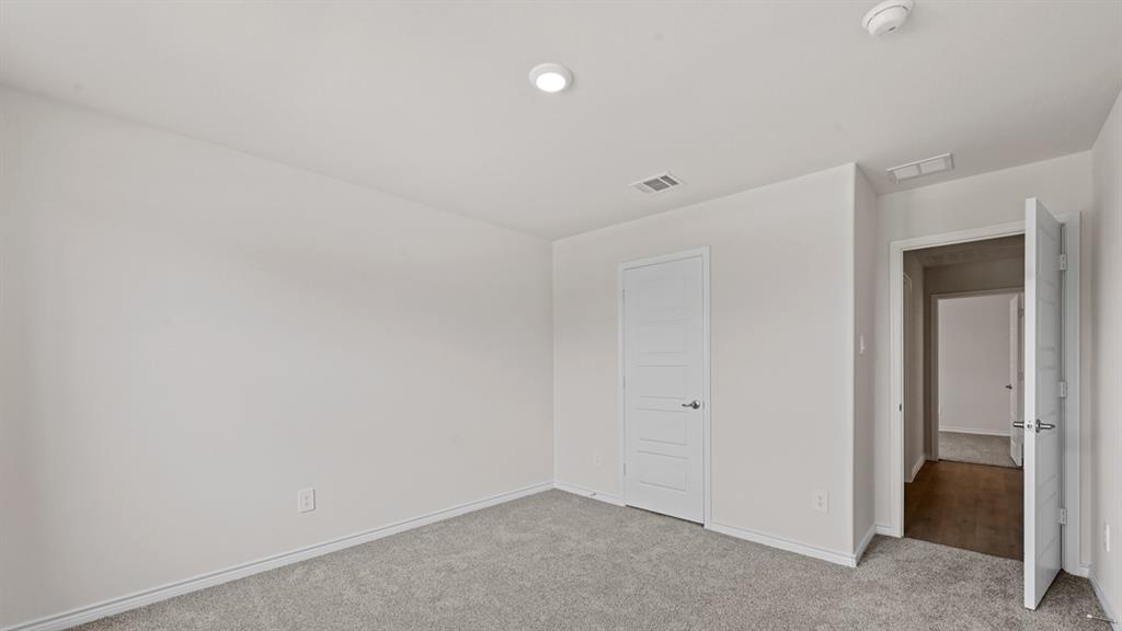 Recessed lighting and light gray walls