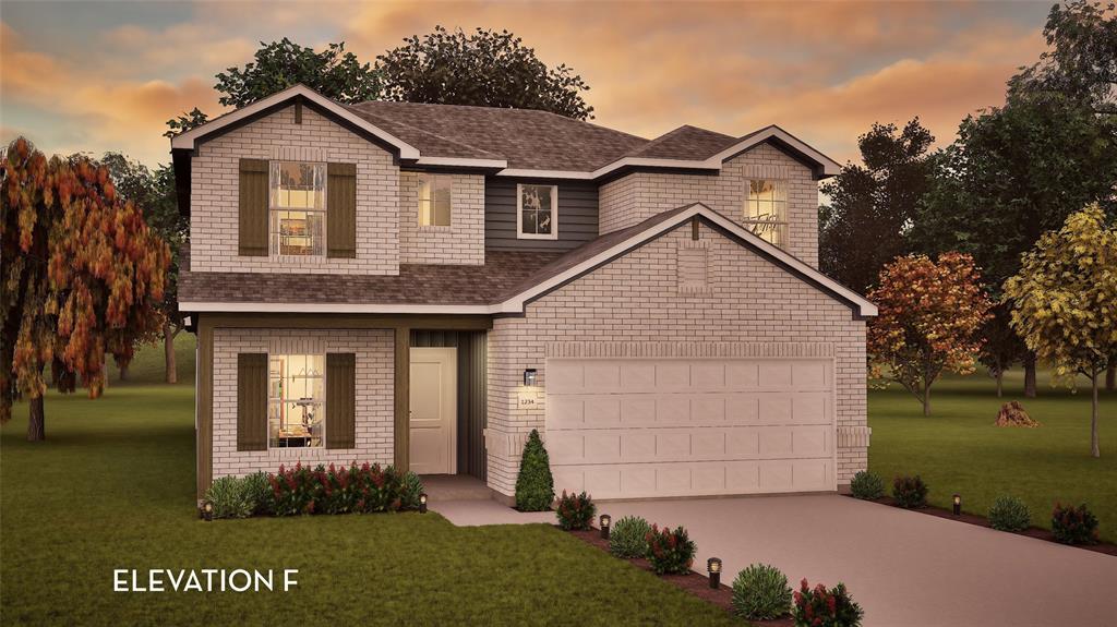 Two-story exterior featuring light-toned brick masonry, dark shutter accents, architectural shingle roof, and a multi-car garage with a concrete driveway