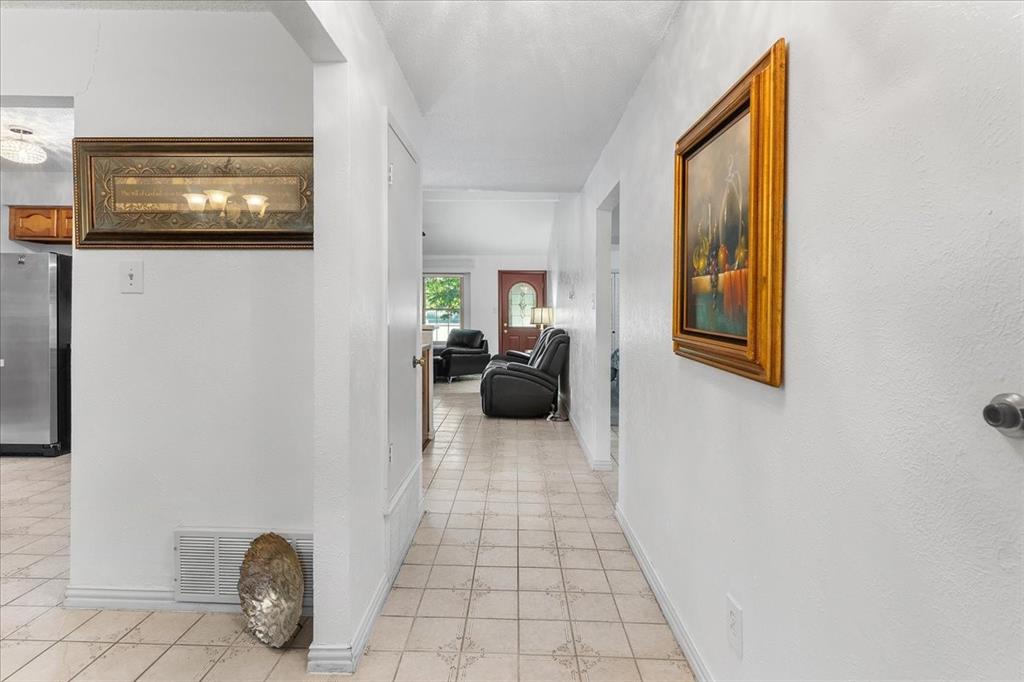 Ceramic tile flooring, neutral wall finishes, and interior passage doors