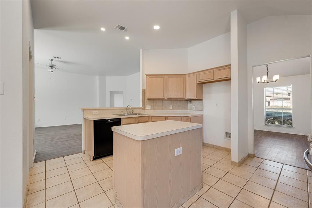 Kitchen featuring light-finish cabinetry, a center island with a neutral countertop, ceramic tile flooring, recessed lighting, and a stainless steel sink with a goose-neck faucet