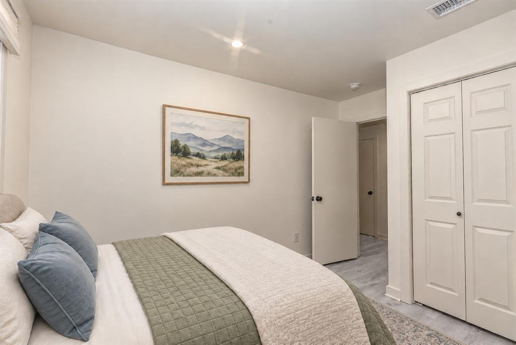 3rd Bedroom also has Neutral-toned walls, wood-finish flooring, and recessed ceiling lighting, and a closet with six-panel bi-fold doors