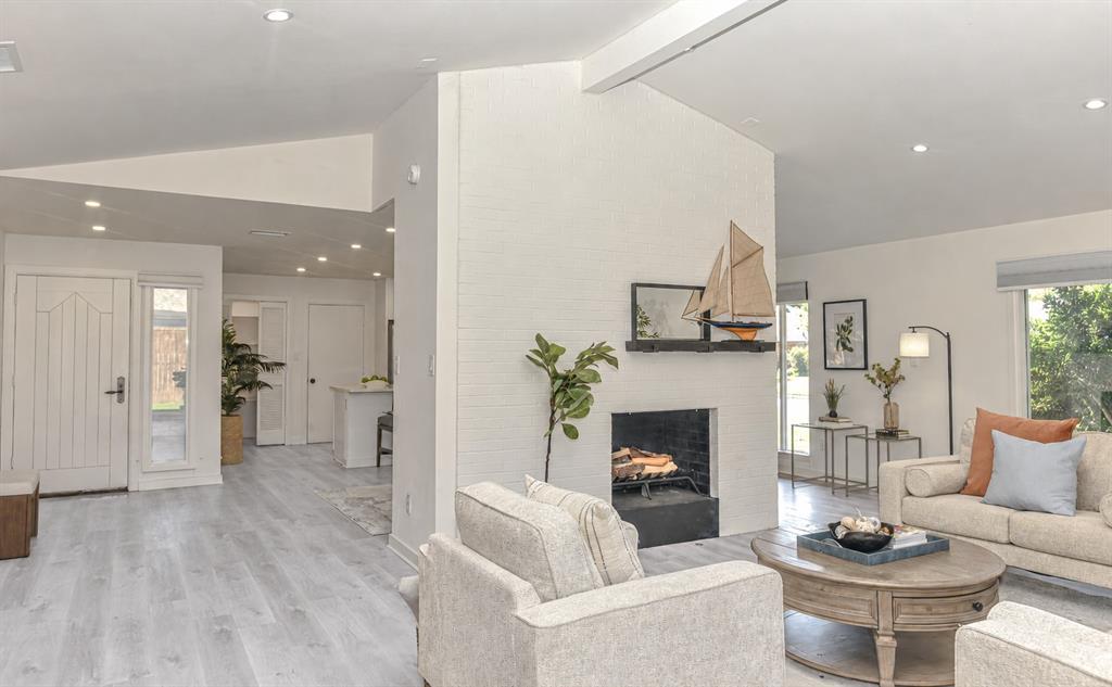 When the nights turn chilly, this white painted brick fireplace ,featuring a black hearth, will warm the mood When the nights turn chilly, this white painted brick fireplace ,featuring a black hearth, will warm the mood