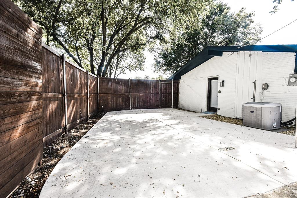 Private rear Sport-court ! Whether you game is basketball, pickleball or just riding the tricycle around - great play-space featuring a concrete patio, stained wood privacy fencing, and exterior brick masonry