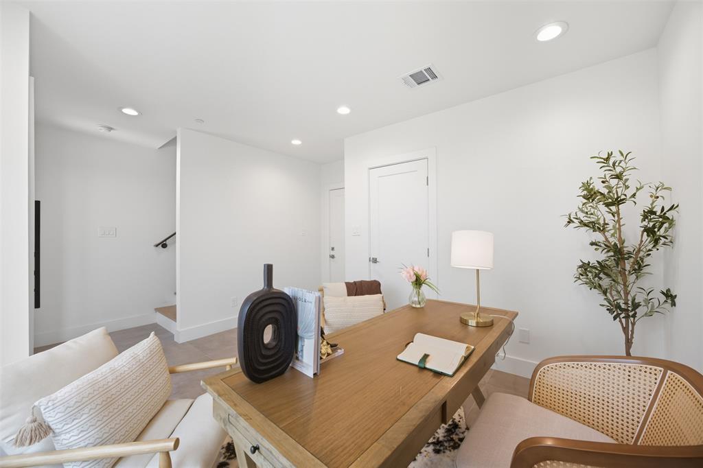 Interior space featuring recessed lighting, smooth white walls, light-toned wood-finish flooring, and shaker-style interior doors